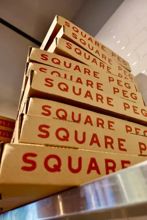 Stacked Square Peg pizza boxes