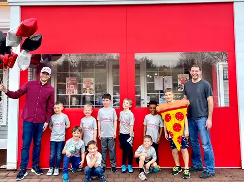 A local youth team celebrating at Square Peg